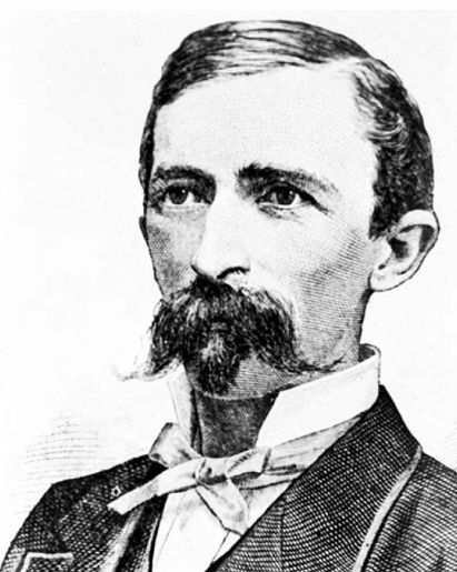 Portrait photograph of young John Harvey Kellogg in formal attire shortly after becoming superintendent